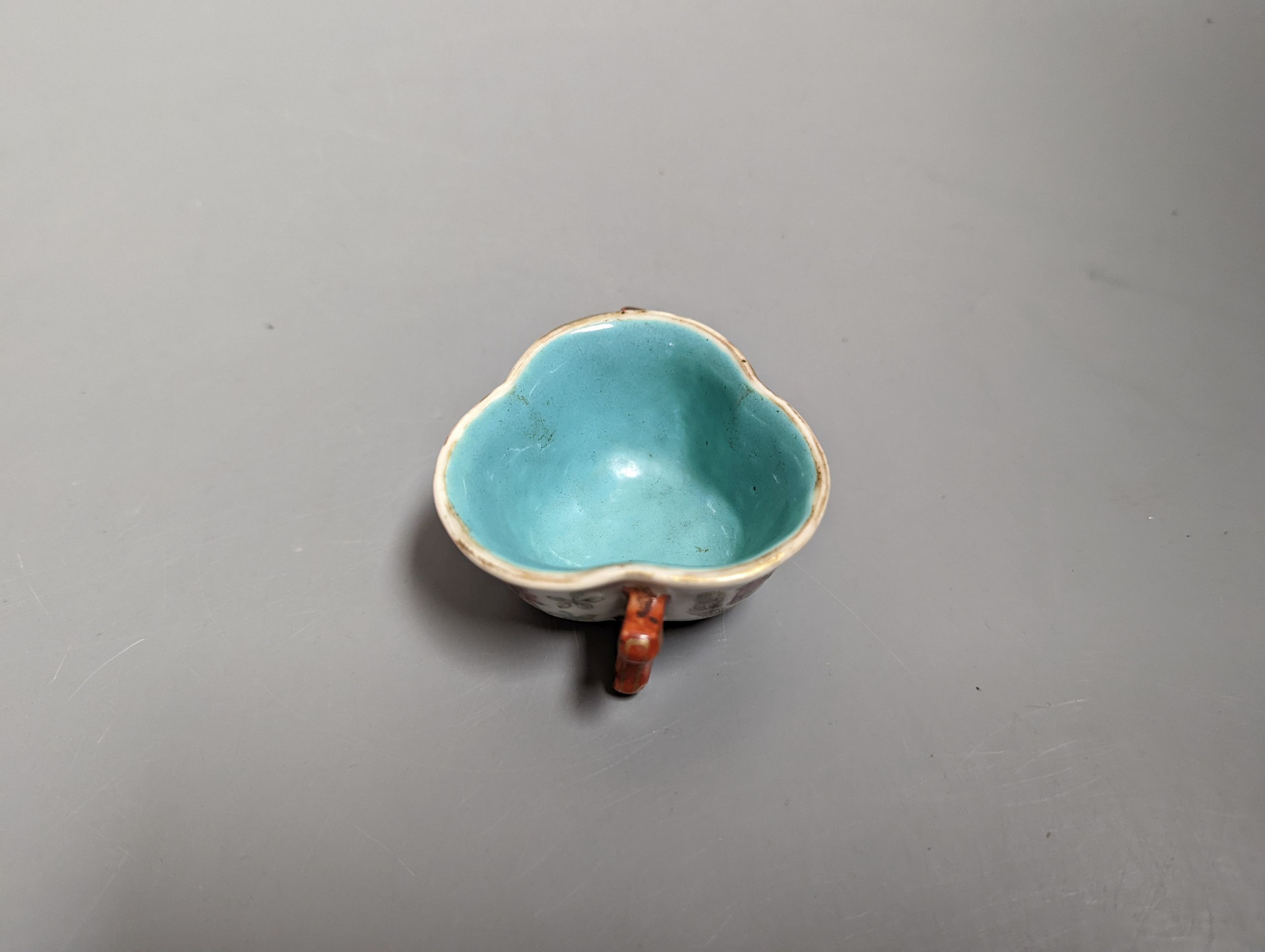 A Chinese enamelled porcelain 'goldfish' cup, Qianlong mark but 19th century, 3cms high